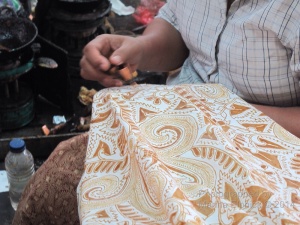 Close up view of woman's canting work, Danar Hadi batik factory